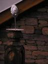 Silver sun over the temple in Naggar.